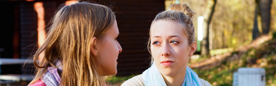 Header image of two women talking
