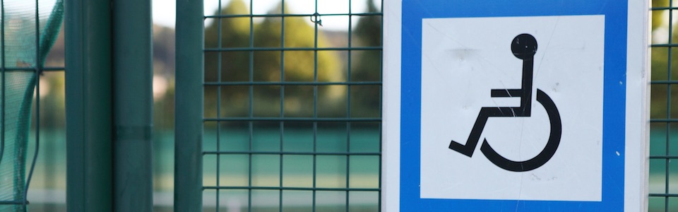 Header image of disabled sign outside tennis court
